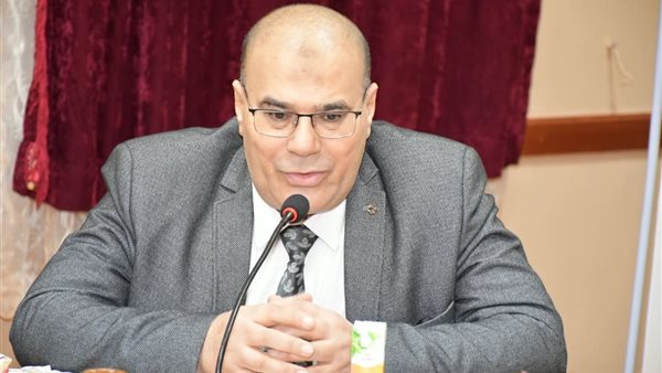 الدكتور غانم السعيد عميد كليتي الإعلام واللغة العربية 